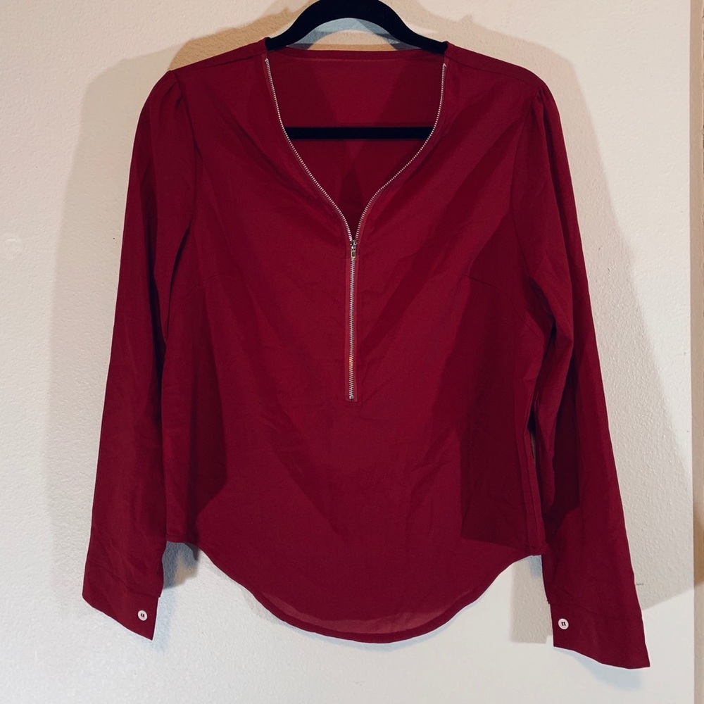 Deep red blouse with elegant detail